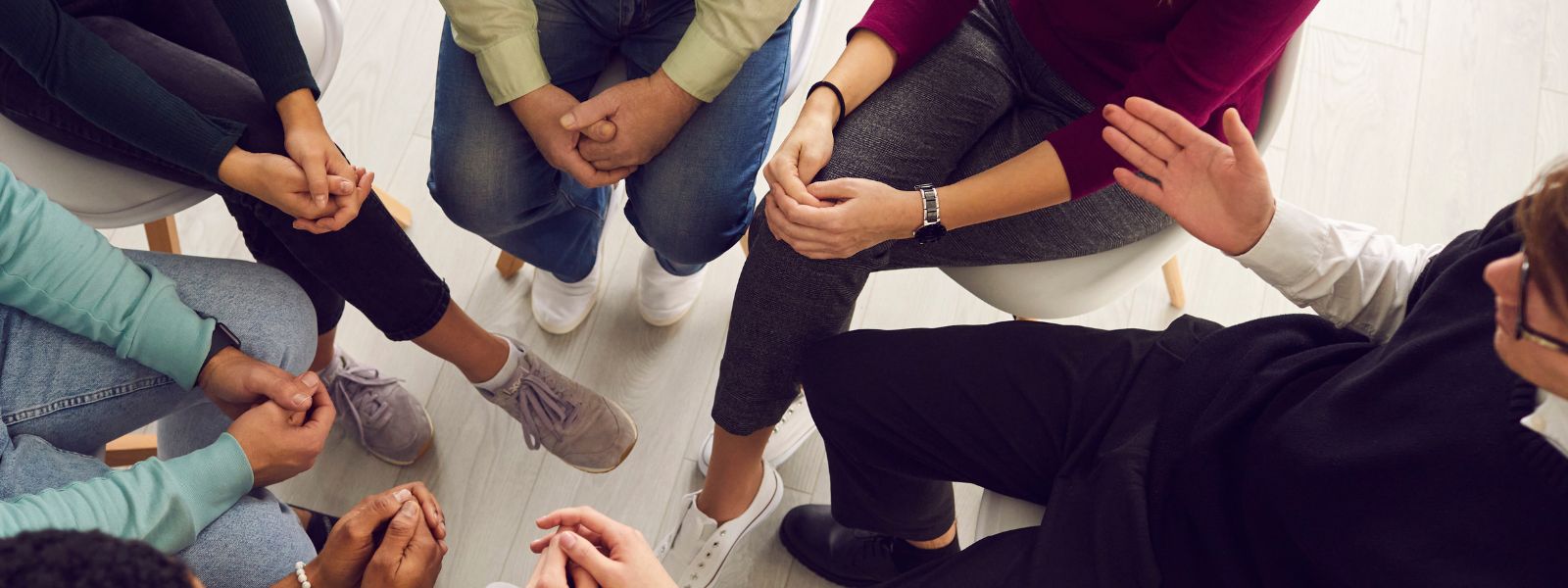 a group of people sitting in a circle